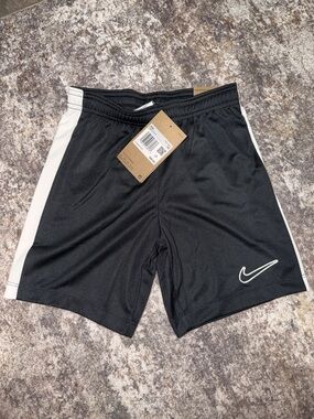Nike Kids Black Athletic Shorts with White Swoosh
